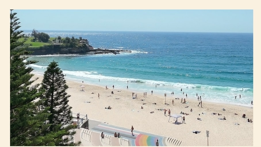 A bright day at Coogee Beach, looking out over the bay from the coastal walk.